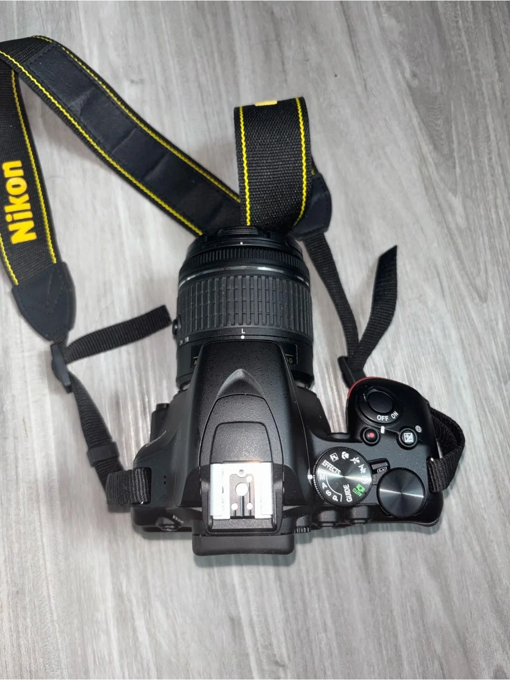 Nikon D3500 Black DSLR Camera with Black Zoom Lens and Red Accent